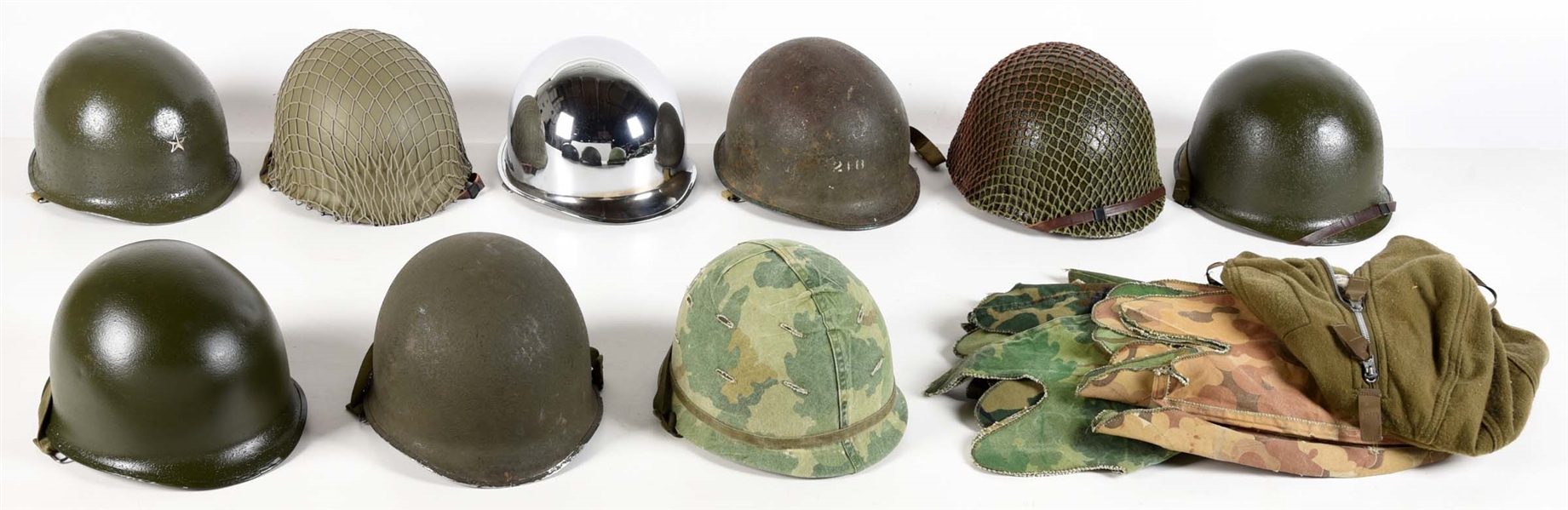 LOT OF US WWII-VIETNAM WAR M1 HELMETS WITH LINERS AND COVERS.