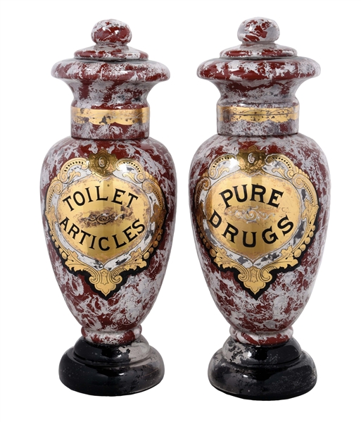 A PAIR OF 19TH CENTURY PHARMACY SHOW JARS ADVERTISING PURE DRUGS AND TOILET ARTICLES.