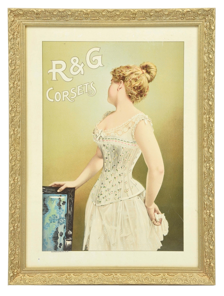 R&G CORSETS TIN SIGN W/ WOMAN GRAPHIC IN CUSTOM FRAME.