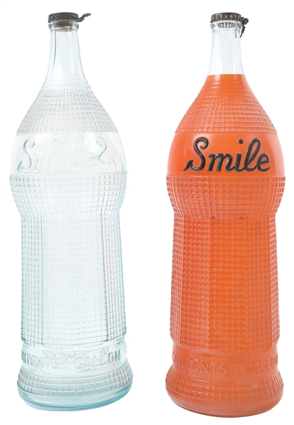COLLECTION OF 2 SMILE SODA POP DISPLAY BOTTLES.