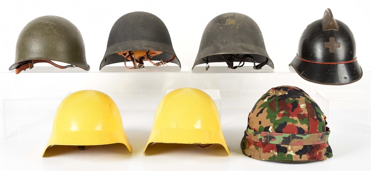 LOT OF 7: SWISS M1918 AND M1971 HELMETS.