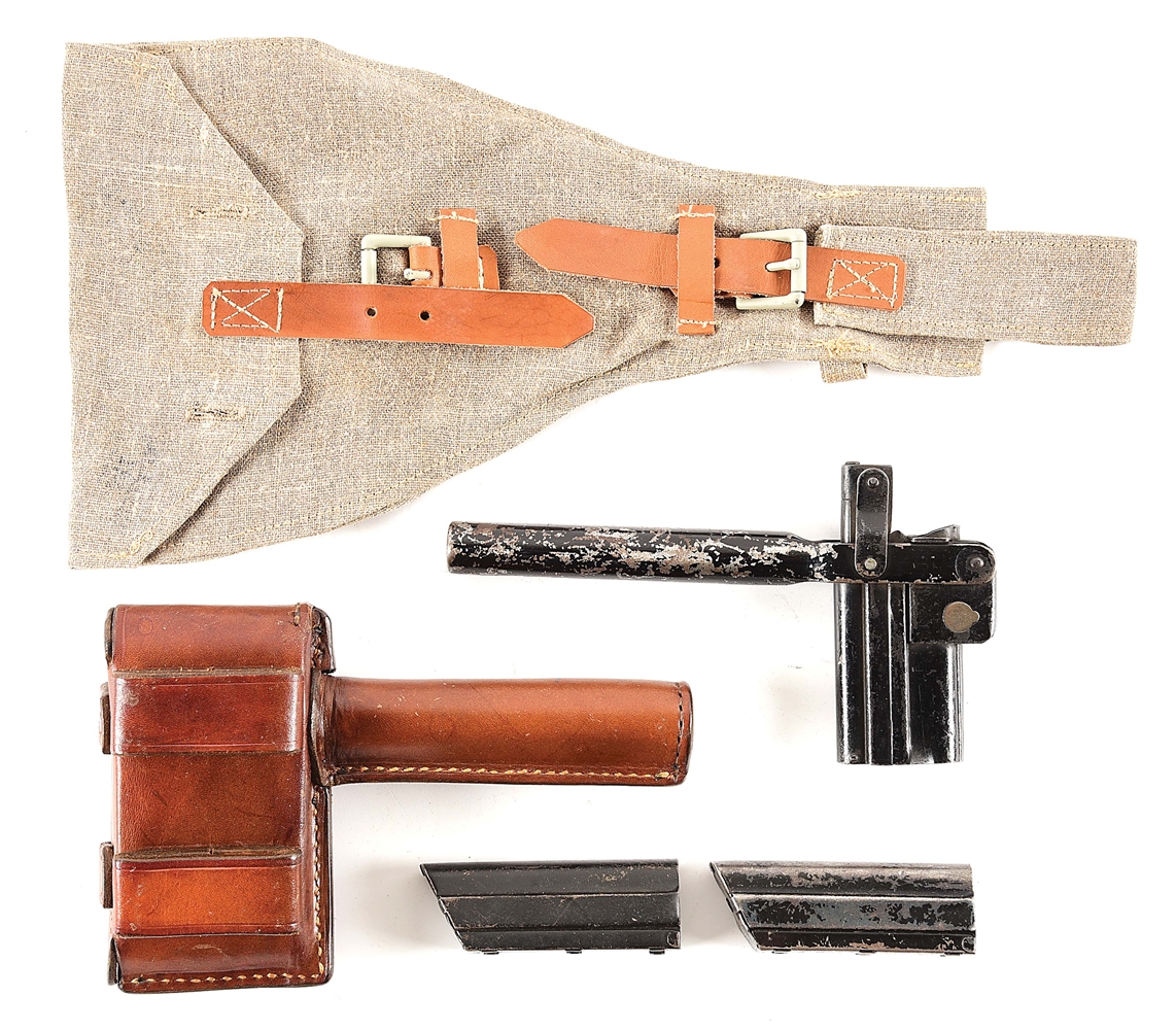 UNMARKED GERMAN LUGER SNAIL DRUM LOADER, LEATHER CARRIER, AND SHEET METAL COVERS FOR LUGER MAGAZINES.