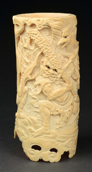 CARVED IVORY TUSK W/ EMBOSSED MAN W/ CLUB FIGHTING WINGED ANIMAL