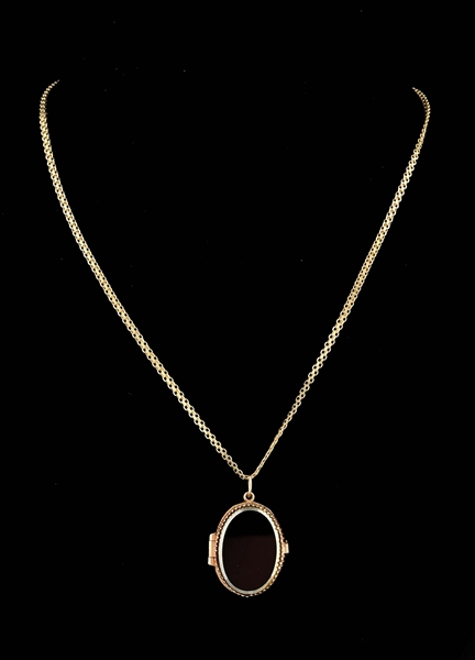 LADIES’ 9K GOLD BLACK ONYX LOCKET WITH 14K GOLD CHAIN.