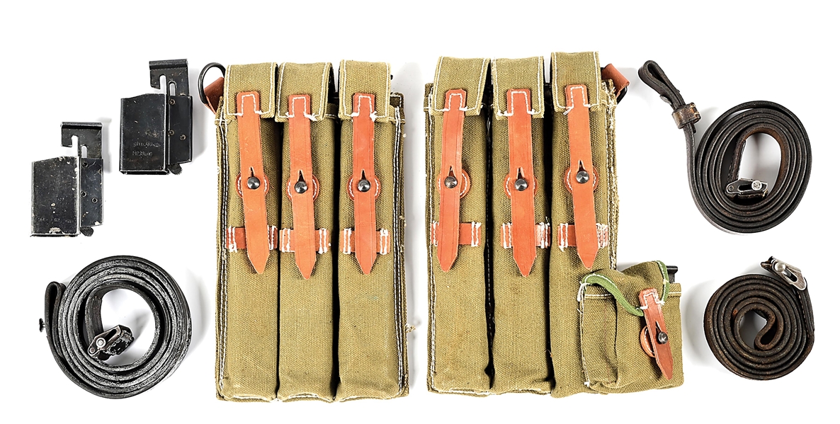 A TREASURE OF ORIGINAL MP-40 MACHINE GUN MAGAZINES, LOADERS, AND SLINGS WITH SET OF REPRODUCTION MAGAZINE POUCHES.