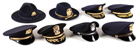 LOT OF 8: OBSOLETE POLICE HATS.
