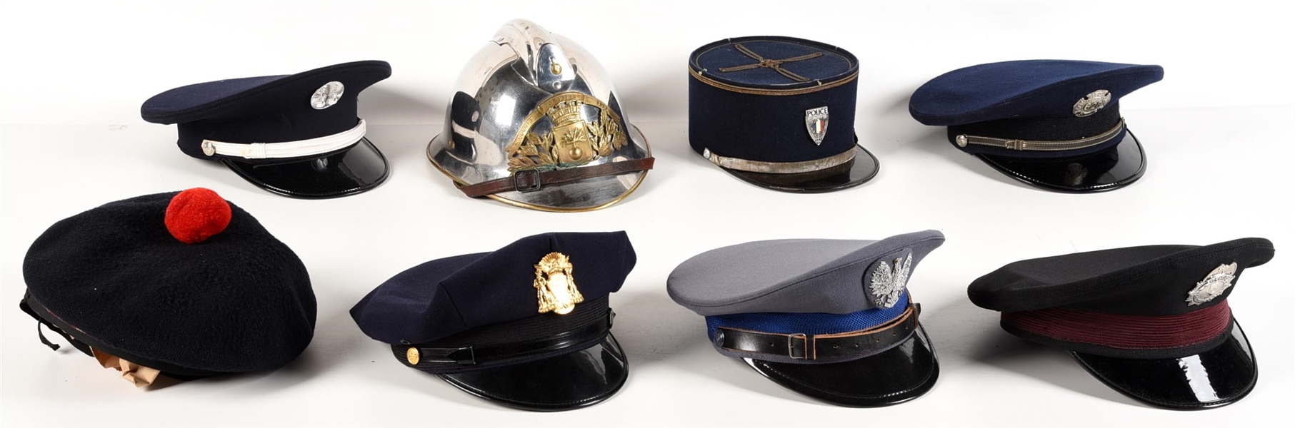 LOT OF 8: EUROPEAN POLICE HATS.