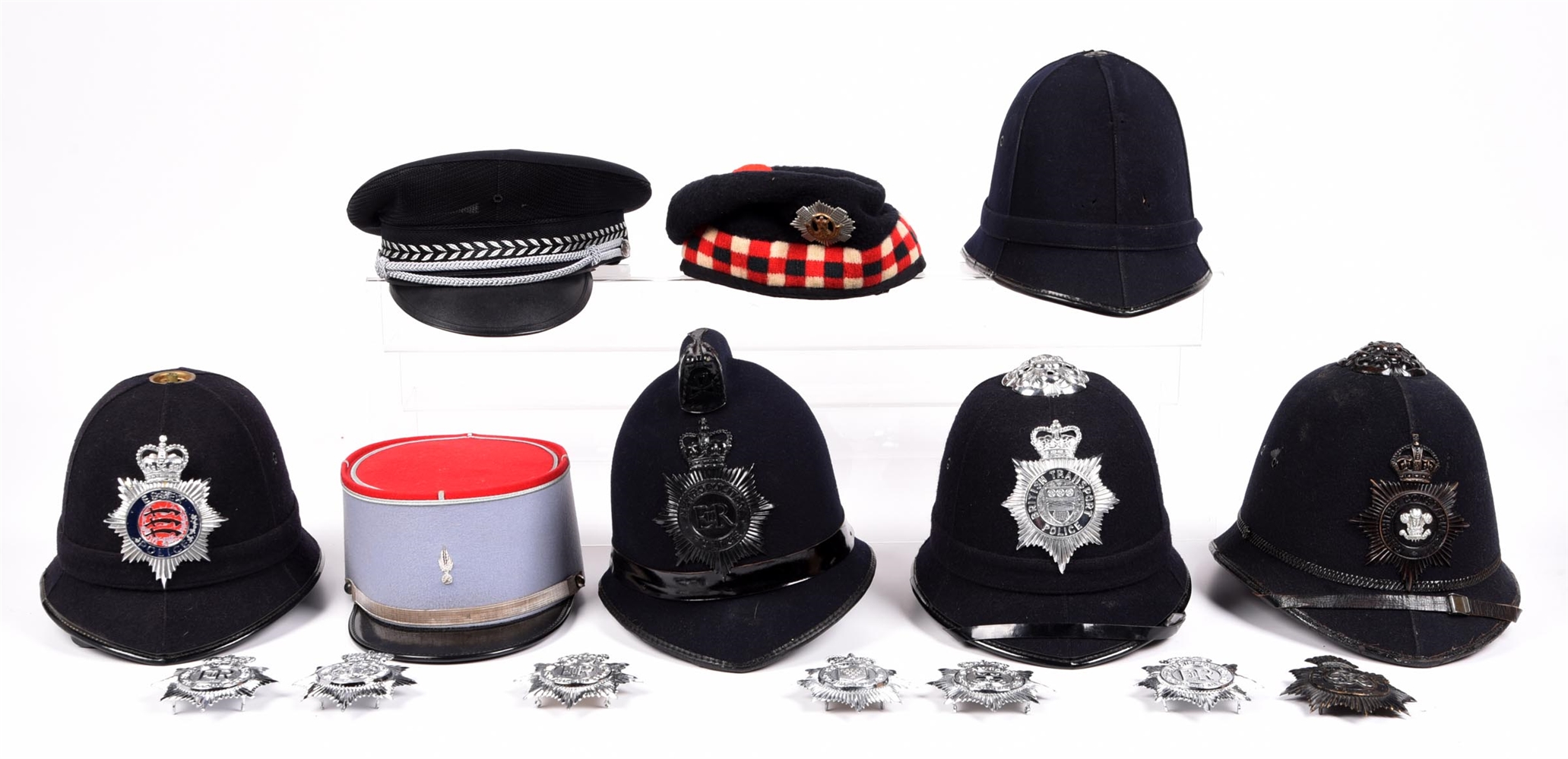 LOT OF 8: POLICE HATS, MOSTLY BRITISH.