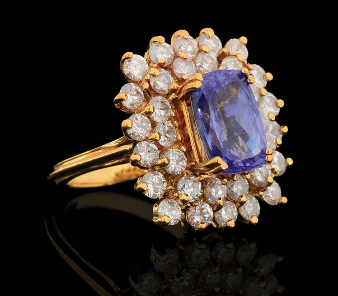 LADIES 18K GOLD 4CT TANZANITE AND DIAMOND RING.