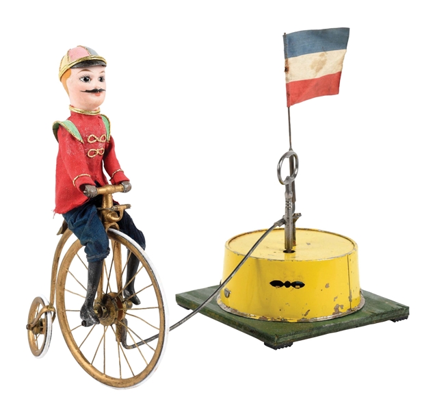 LATE 19TH CENTURY FRENCH HIGH-WHEELED BICYCLE RIDER RIDING AROUND BASE TOY