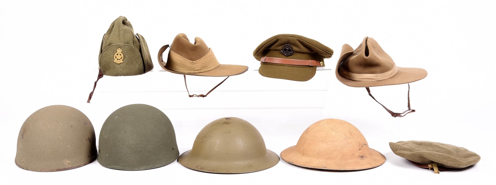 LOT OF BRITISH AND AUSTRALIAN WWII WWII ERA HATS AND HELMETS.