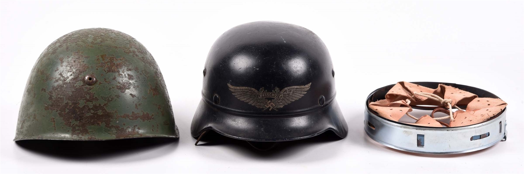 LOT OF 3: GERMAN LUFTSHUTZ HELMET, ITALIAN M33 HELMET, AND REPRODUCTION GERMAN HELMET LINER.