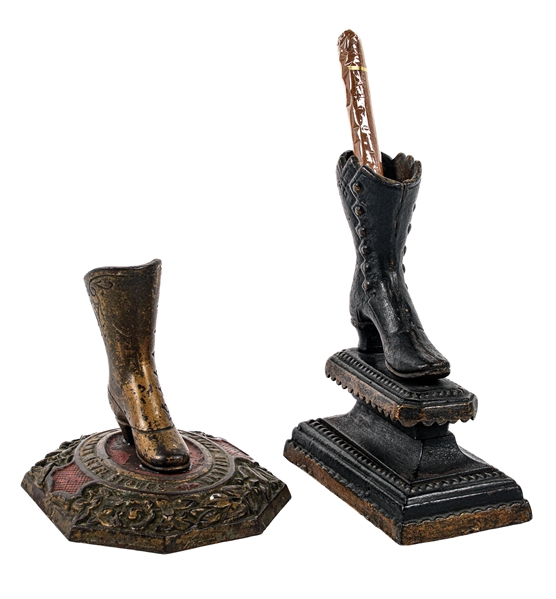 A PAIR OF FIGURAL CAST IRON MATCH HOLDERS