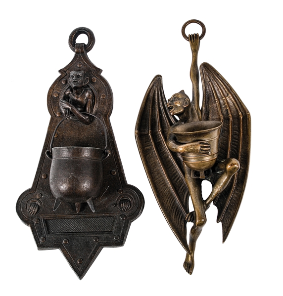 A PAIR OF BRONZE WALL HANGING MATCH HOLDERS