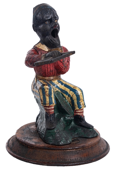 FIGURAL CAST IRON CIGAR CUTTER IN THE FORM OF A YOUNG TURKISH MAN
