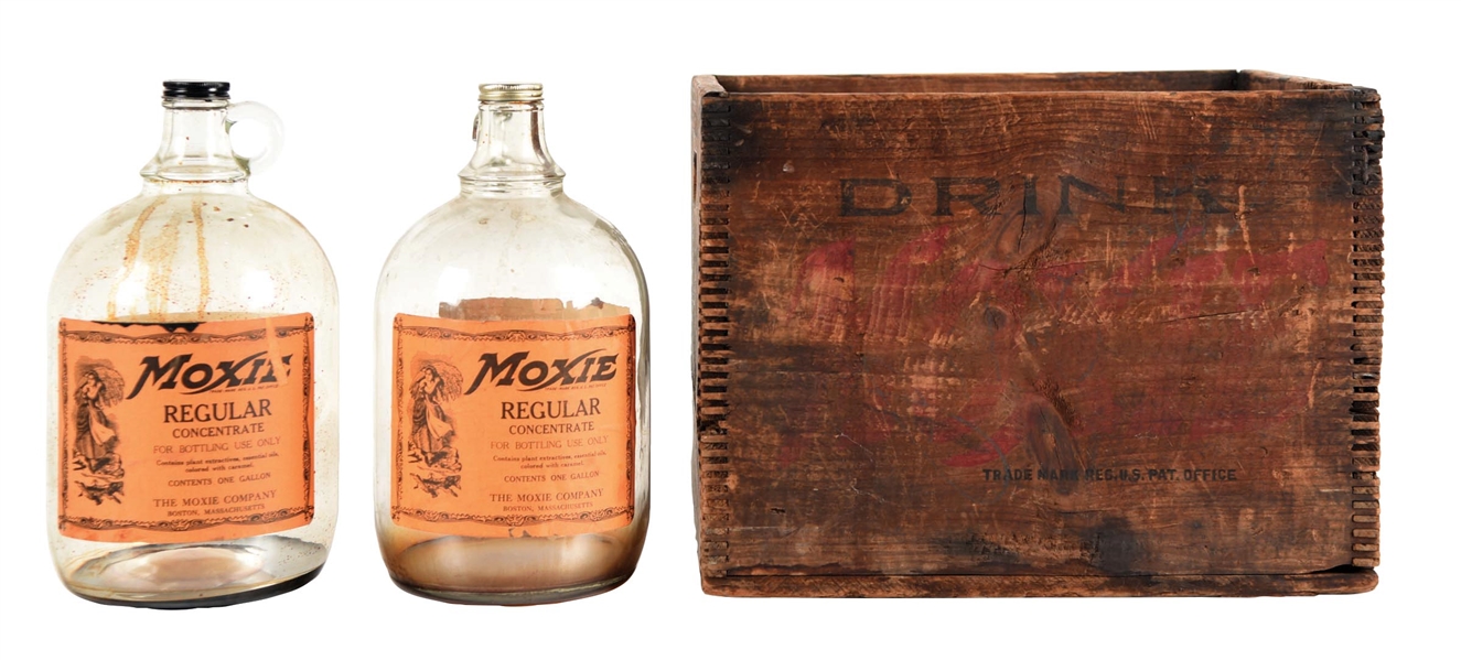 COLLECTION OF 3 MOXIE SYRUP BOTTLES AND WOODEN CRATE.