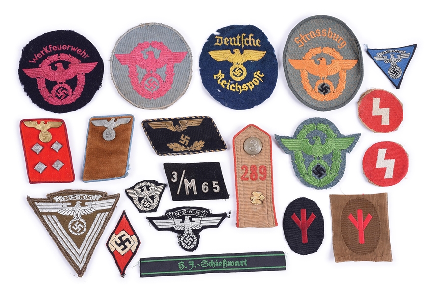 LOT OF THIRD REICH POLICE AND POLITICAL INSIGNIA.