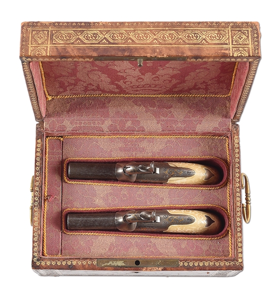 (A) CASED PAIR OF GOLD INLAID BELGIAN MUFF PISTOLS WITH CARVED IVORY GRIPS.