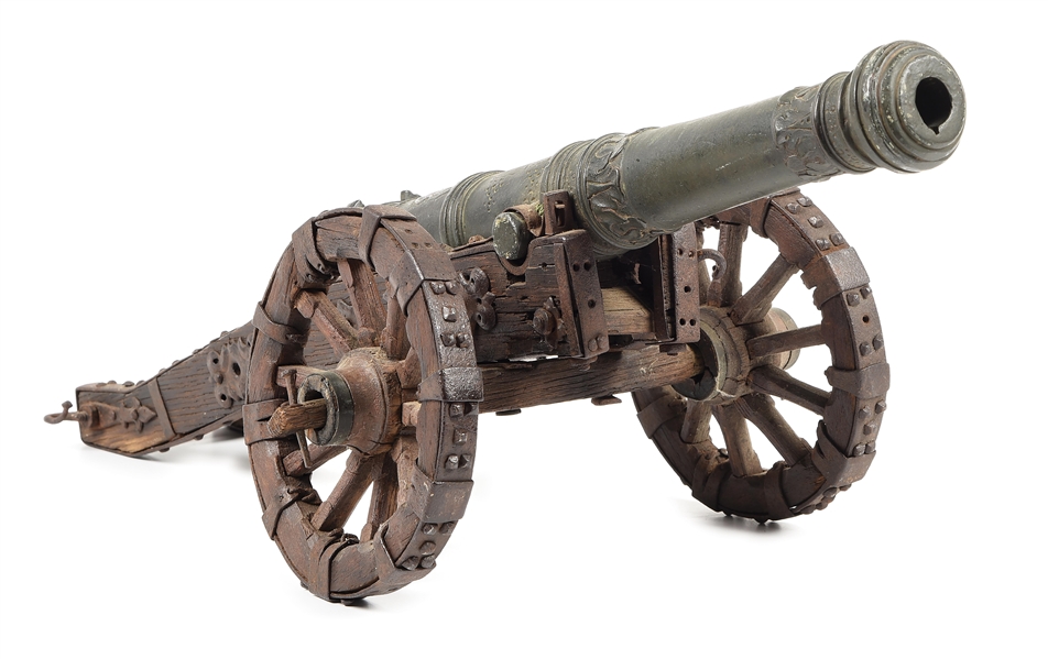 LATE 17TH CENTURY OR EARLY 18TH CENTURY FIRING BRONZE CANNON MODEL WITH ORIGINAL CARRIAGE.