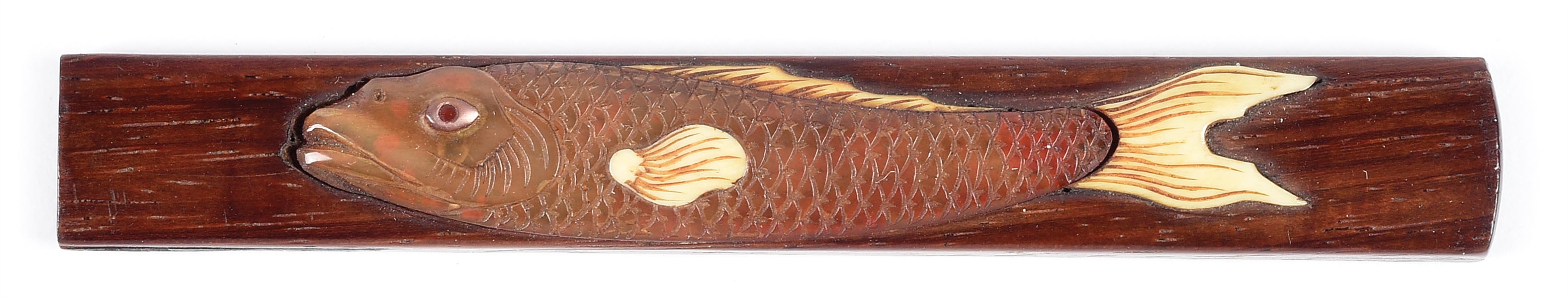 UNUSUAL WOOD HANDLED KOZUKA DEPICTING A FISH WITH MOTHER OF PEARL AND IVORY ACCENTS.