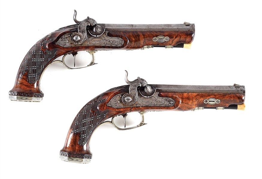 (A) A PAIR OF SILVER MOUNTED PERCUSSION PISTOLS SIGNED KREISSER / LIEPZIG.