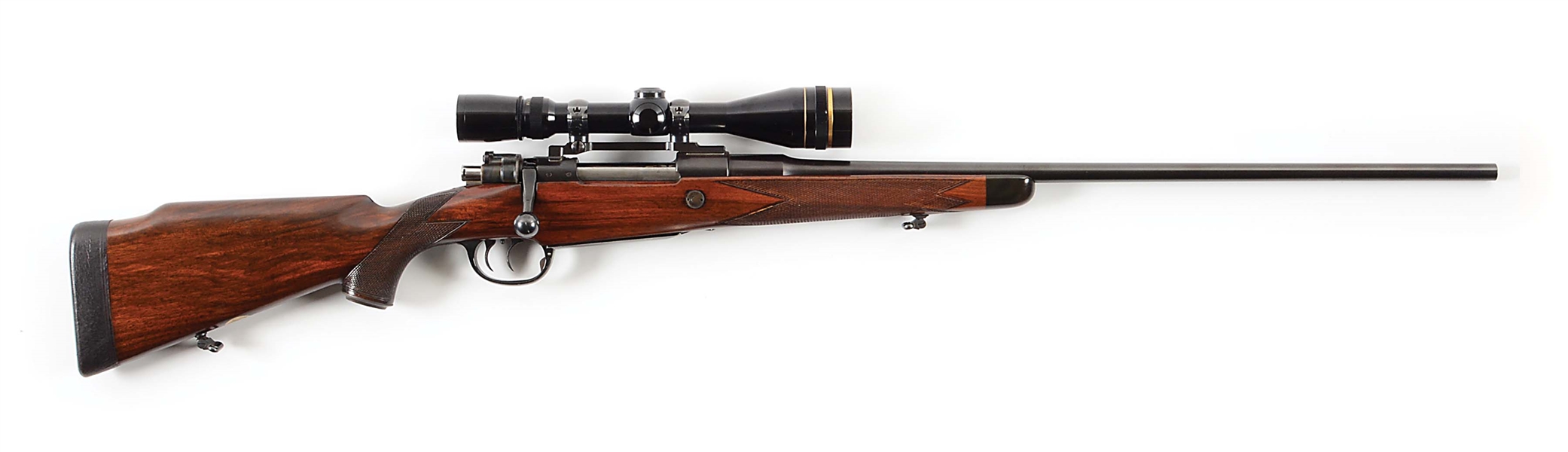 (C) HOLLAND & HOLLAND BOLT ACTON RIFLE IN .244 MAGNUM WITH LEUPOLD SCOPE.