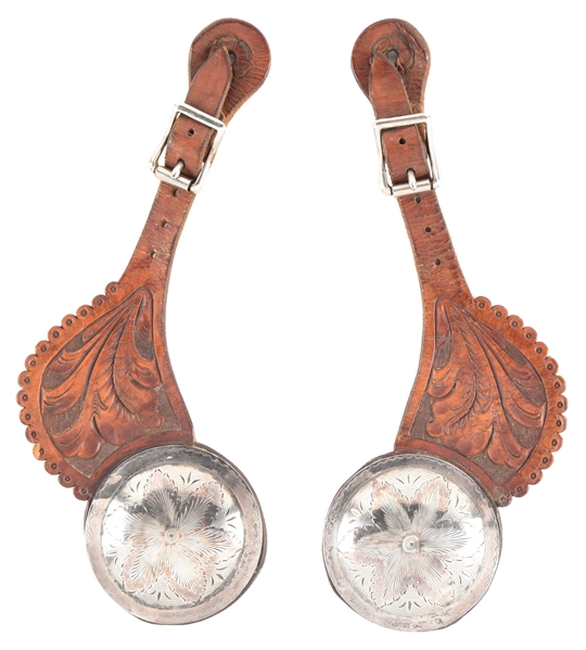 LEATHER STRAPS WITH LARGE CONCHOS. 