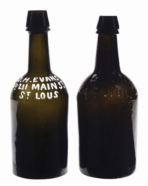 PAIR OF D. H. EVANS EMBOSSED RAISED LETTER BEER BOTTLES