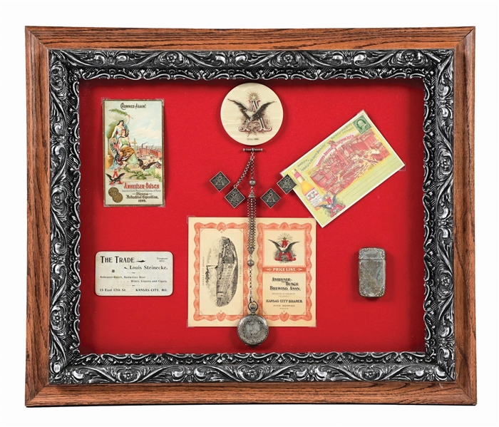 ANHEUSER-BUSCH BUDWEISER SHADOWBOX OF METAL POCKET WATCH FOB, TRADE CARDS & MATCH SAFE