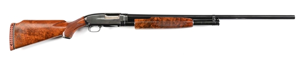 (C) WINCHESTER MODEL 1912 SLIDE ACTION 12 GAUGE SHOTGUN.