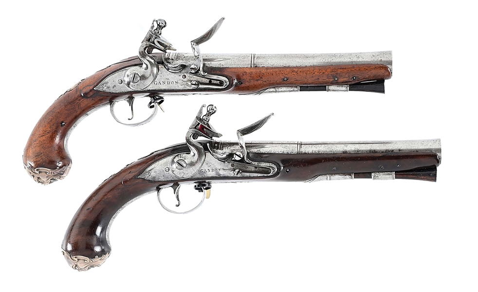 (A) BRACE OF SILVER AND IRON MOUNTED FLINTLOCK PISTOLS BY GANDON.