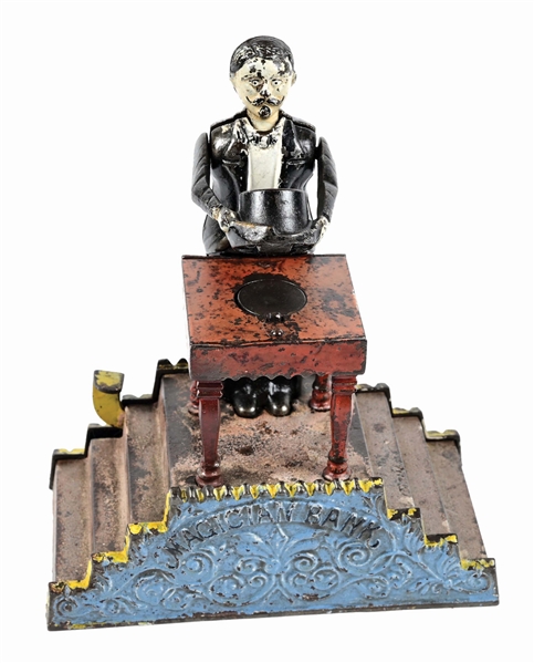 J. & E. STEVENS MAGICIAN CAST IRON MECHANICAL BANK