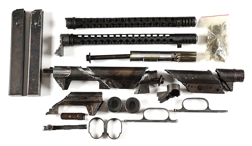 NICE GROUPING OF ITALIAN BERETTA 38A MACHINE GUN PARTS INCLUDING BARRELS SHROUDS AND MAGAZINES.