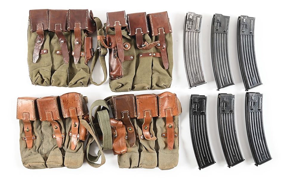 SIX ORIGINAL GERMAN MP-44 MACHINE GUN MAGAZINES WITH TWO SETS OF REPRODUCTION MAGAZINE POUCHES.