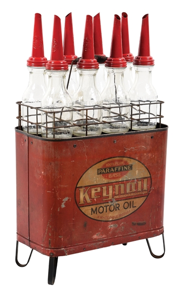 KEYNOIL MOTOR OIL BOTTLE STAND W/ CARRIER AND 8 OIL BOTTLES. 