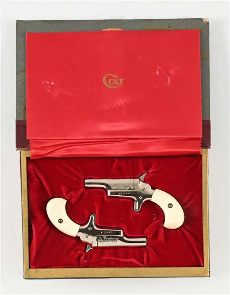 (C) BOOK CASE SET OF CONSECUTIVELY SERIAL NUMBERED COLT DERRINGERS.