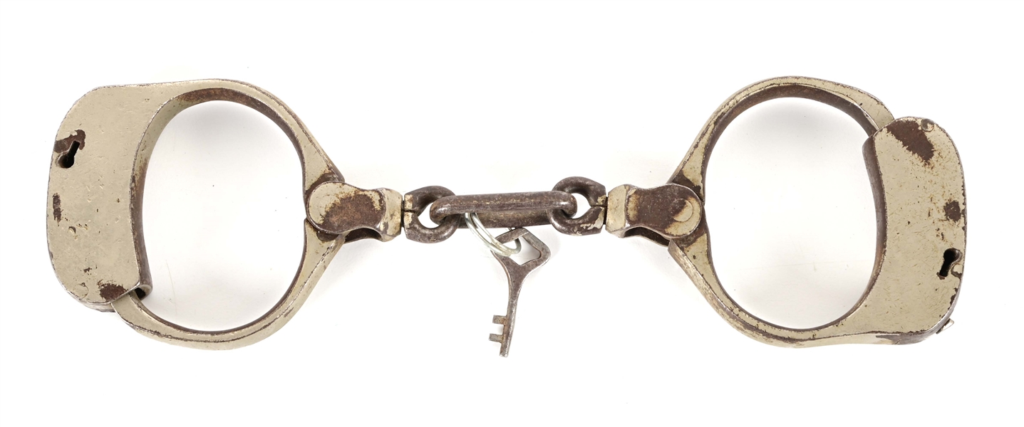 SMALL ANTIQUE HANDCUFFS.