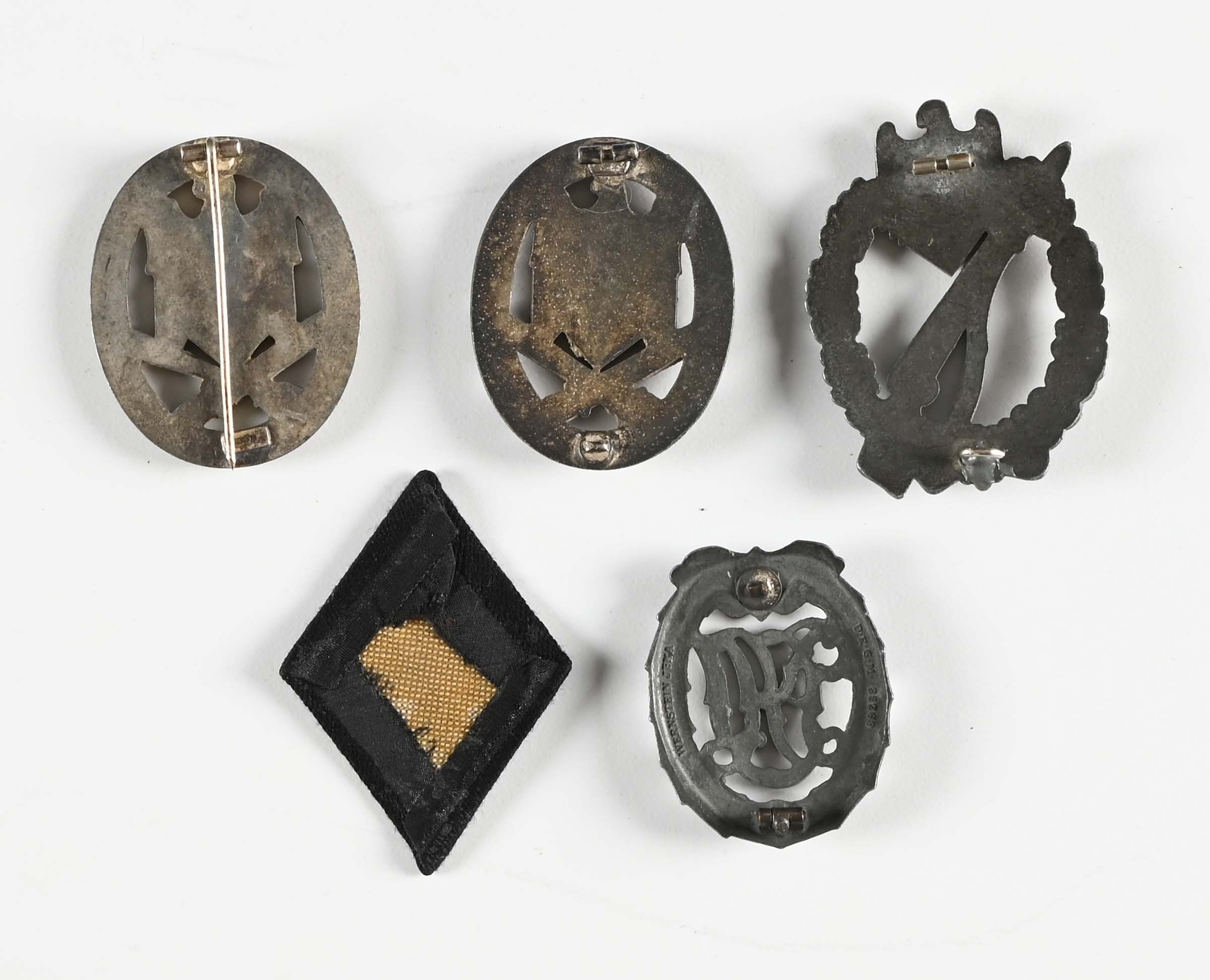 Lot Detail - LOT OF 5: 4 THIRD REICH BADGES AND 1 POLICE PATCH.