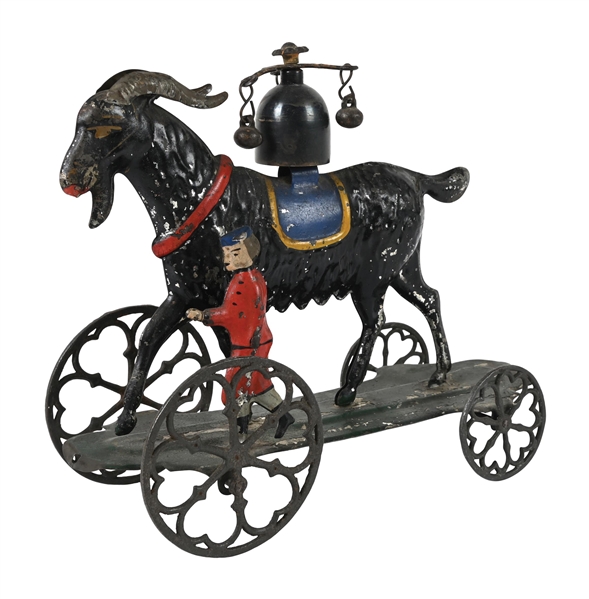LARGE EARLY AMERICAN TIN GOAT ON PLATFORM TOY