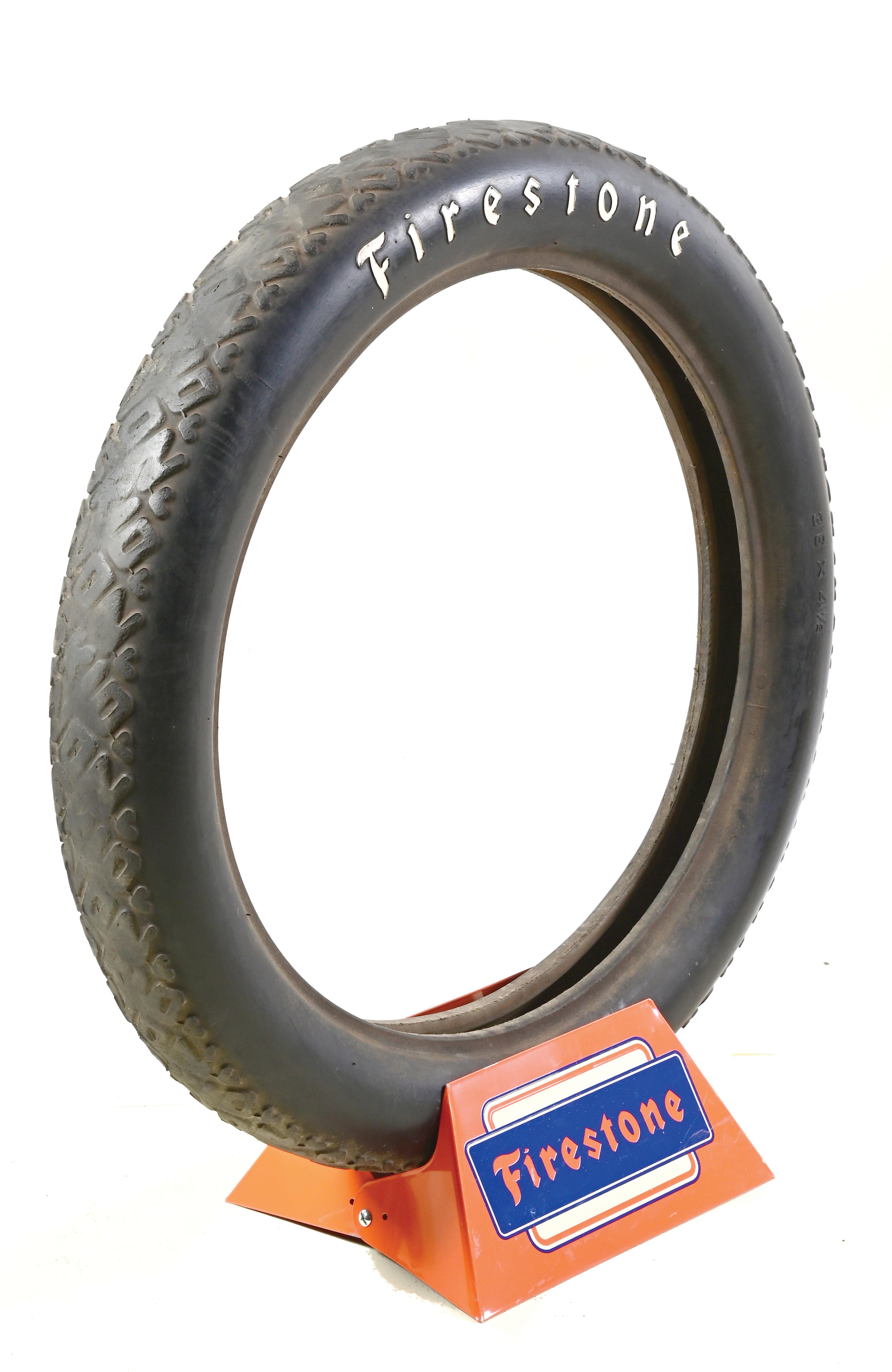 Lot Detail - FIRESTONE TIRE TIN DISPLAY STAND WITH ORIGINAL FIRESTONE TIRE.