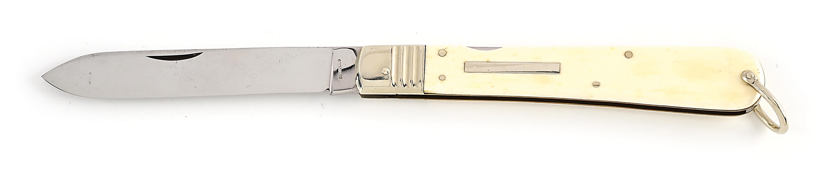 SHEFFIELD IVORY COLOR SCRIMSHAWED HANDLE MID-LOCK LOCK BACK KNIFE WITH BAIL.