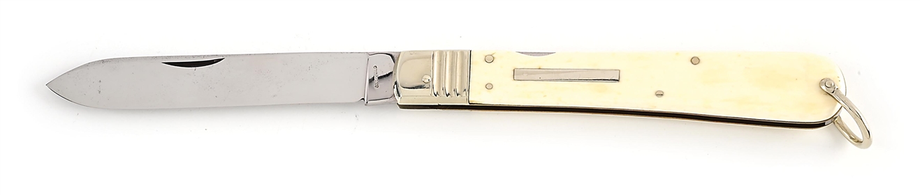 SHEFFIELD IVORY COLOR SCRIMSHAWED HANDLE MID-LOCK LOCK BACK KNIFE WITH BAIL.