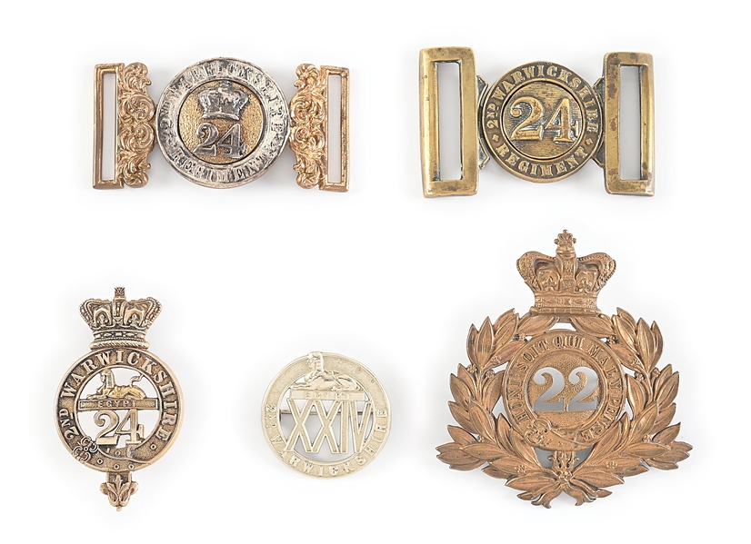 LOT OF BRITISH 24TH REGIMENT OF FOOT BELT BUCKLES AND CAP BADGES.