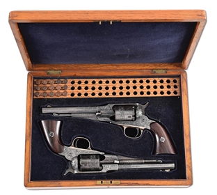 (A) PAIR OF ENGRAVED REMINGTON NEW MODEL BELT MODEL .38 RF SINGLE ACTION REVOLVERS IN FRENCH FITTED CASE.