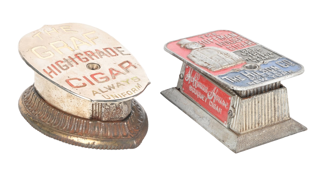 A PAIR OF COUNTERTOP COMMERCIAL ADVERTISING CIGAR CUTTERS