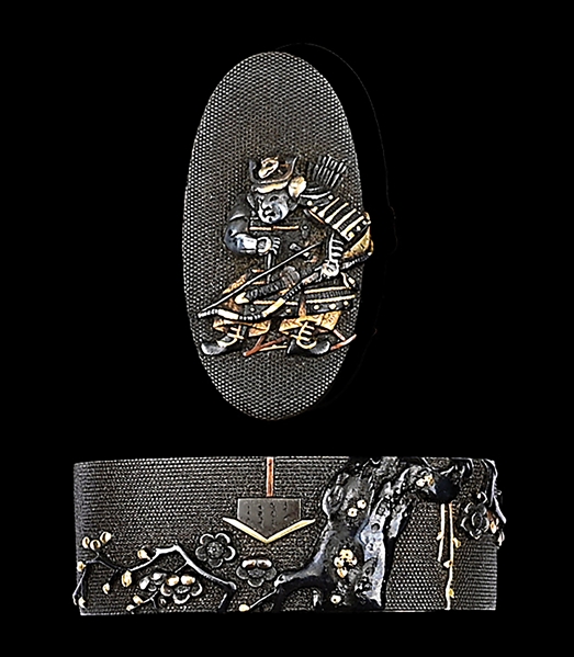 FUCHI KASHIRA SIGNED MASATSUNE WITH DESIGNS OF PLUM TREE AND SAMURAI