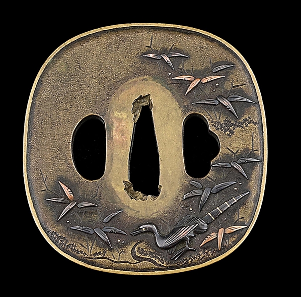 AN EDO PERIOD TSUBA DEPICTING A PEACOCK