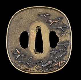 AN EDO PERIOD TSUBA DEPICTING A PEACOCK