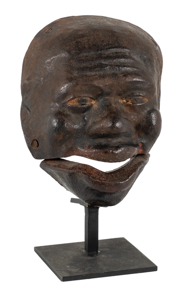 MASK MOUNTED TO A WOODEN FRAME ON CAST IRON STAND