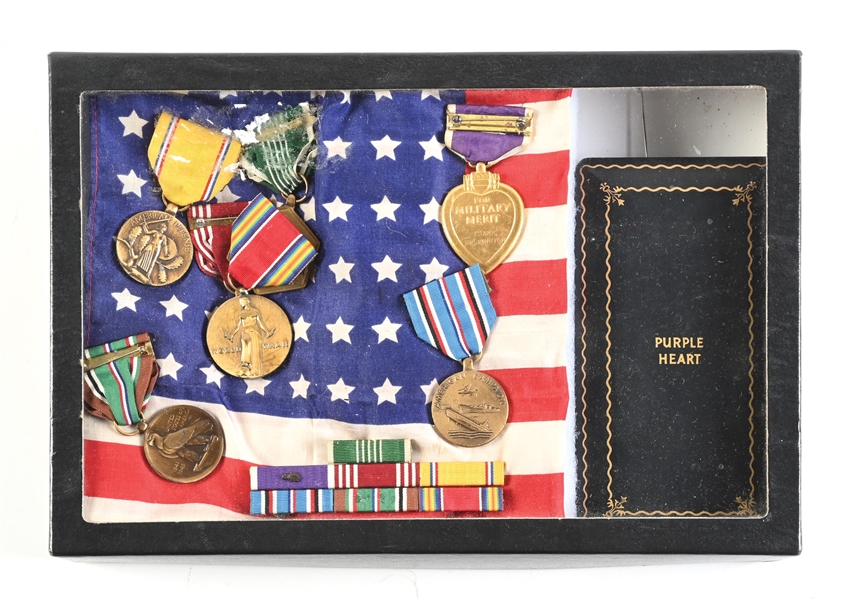 US WWII NAMED PURPLE HEART MEDAL GROUPING.
